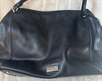 May include: Black leather tote bag with a silver logo and gold hardware.