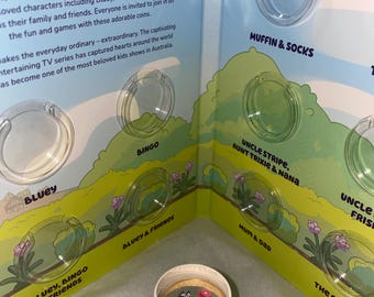 Juego de monedas de color azul en tubo 2024