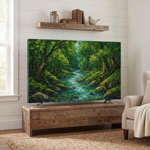 May include: A large flat-screen television displaying a vibrant oil painting of a lush green forest with a flowing river. The television rests on a rustic wooden media console, positioned below a matching wooden floating shelf with decor.