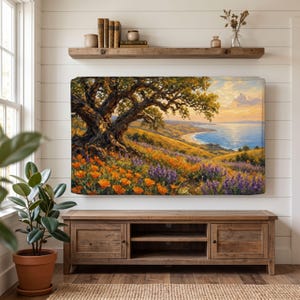 May include: A rectangular wall art print featuring an oil painting of a large oak tree overlooking a coastal landscape with orange poppies and purple wildflowers in the foreground, set against a sunset sky over a blue ocean and sandy beach.