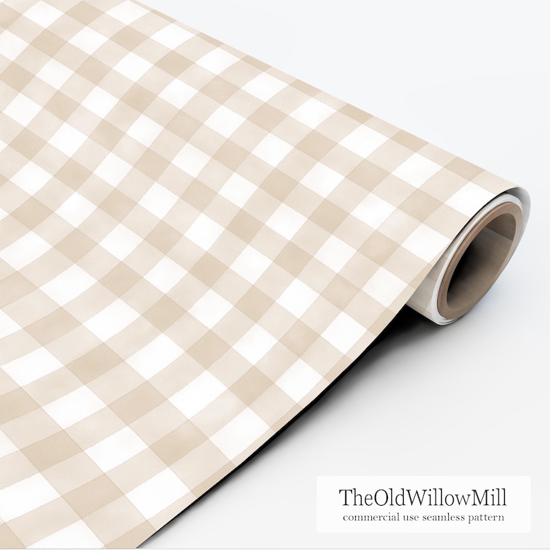 May include: A roll of beige and white gingham patterned paper. The pattern is a classic check design, with soft, watercolor-like edges. The paper is rolled up, showing the edge of the roll. Text on the paper reads "TheOldWillowMill commercial use seamless pattern."