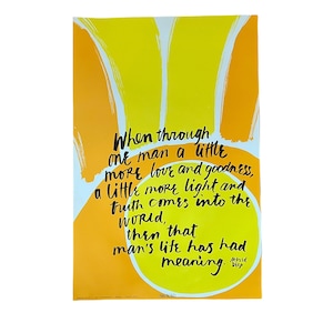 May include: A yellow and orange poster with a quote by Alfred D. Souza: "When through one man a little more love and goodness, a little more light and truth comes into the world, then that man's life has had meaning."