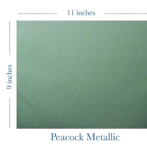 May include: A 9 by 11 inch sheet of peacock metallic green heat transfer vinyl. The vinyl is textured and has a metallic sheen. The text "Glam Flex" is visible in the bottom right corner of the image.