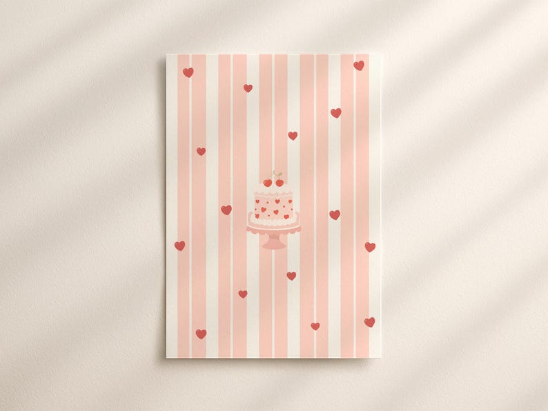 May include: A rectangular print featuring a pink and white striped background with scattered red hearts. A pink cake with heart decorations and cherries sits on a cake stand. The print has a soft, romantic aesthetic.