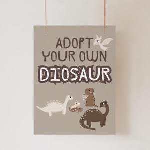 May include: A poster with the text "ADOPT YOUR OWN DINOSAUR" in brown and white. The poster features illustrations of several dinosaurs in various colors, including white, brown, and dark brown. A small white dragon is also present.