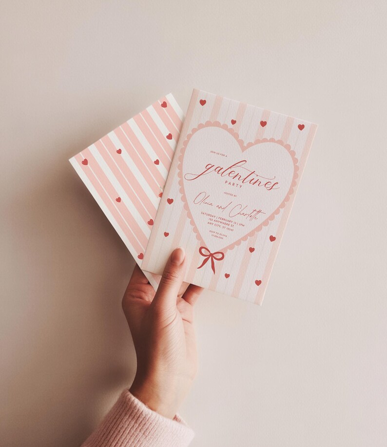 May include: A Galentine's Party invitation with a pink and white striped design. The invitation features a heart-shaped design with the words "Galentine's Party" and the names "Olivia and Charlotte". Small red hearts are scattered across the invitation.