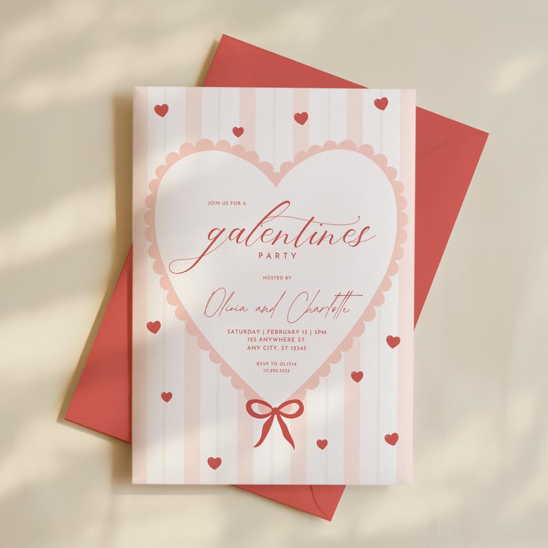 May include: A Galentine's Party invitation with a pink and white striped background. The invitation features a heart-shaped design with the words "Galentine's Party" in cursive script. Small red hearts are scattered around the invitation, and a red envelope is behind the invitation.