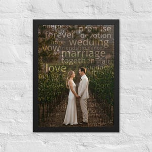 May include: A framed wall art print featuring a photograph of two people standing in a vineyard, overlaid with a word cloud of wedding-themed terms like love, marriage, and promise in gold text against a dark, natural background.