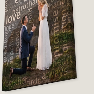 May include: A rectangular canvas print featuring a marriage proposal scene with a person in a dark suit kneeling before a person in a white lace dress. The background is overlaid with various words including love, betrothal, promise, and always.