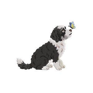 May include: An embroidered design of a black and white dog sitting and looking up at a blue and yellow butterfly. The dog has a fluffy coat and is sitting on its hind legs. The butterfly is hovering near the dog's nose.