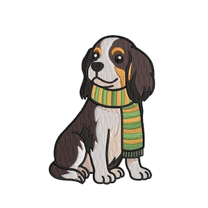 May include: An embroidered design of a seated dog with brown, white, and black fur, wearing a green and yellow striped scarf. The dog has large, expressive eyes and is set against a white background.