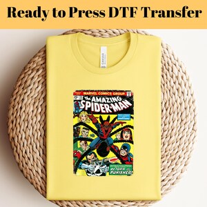 May include: Yellow t-shirt with a vintage comic book print of Spider-Man. The comic book cover features the text "The Amazing Spider-Man" and "Return of the Punisher!"