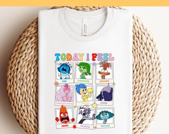 May include: White t-shirt with a graphic of the characters from the movie Inside Out. The graphic says "Today I Feel" and has nine squares with different emotions: Sad, Disgusted, Anxious, Embarrassed, Joyous, Bored, Angry, Fearful, and Envious.