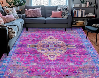May include: A rectangular area rug featuring a vibrant magenta and blue color palette with a central cream-colored medallion and intricate floral patterns throughout. The text FavoriteRugDesign is printed in white at the bottom center.