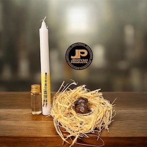 May include: A white candle with yellow accents, a small glass bottle with a gold cap, and a nest-like arrangement with a dark stone. The image includes a logo that says "JEHOVAH PRODUCTS".
