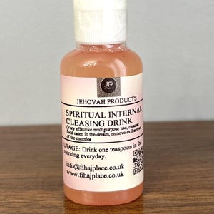 May include: A clear bottle with a white cap and a pink liquid inside. The label reads "JEHOVAH PRODUCTS SPIRITUAL INTERNAL CLEASING DRINK." The text also includes usage instructions and contact information.