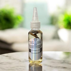May include: A clear glass bottle of Special Favour Oil with a white label and a clear plastic applicator. The label includes the text "SPECIAL FAVOUR OIL (Chen)" and a website address. The bottle contains a light yellow liquid and a dark brown object.