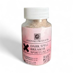 May include: A transparent glass jar with a white lid, containing light brown salt. The label displays "JEHOVAH PRODUCTS DARK SPELL BREAKER SPIRITUAL SALT" and a black cross. The jar is set against a white backdrop.