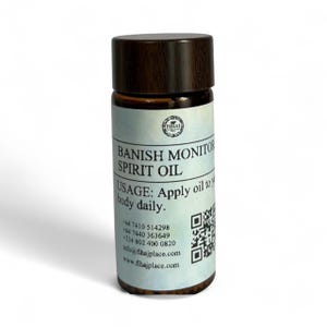 May include: A small glass bottle with a dark brown cap. The label reads "BANISH MONITOR SPIRIT OIL" with usage instructions. The bottle also includes contact information and a QR code.