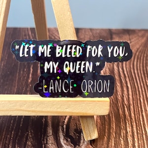 May include: A black sticker with iridescent glitter stars and the quote "Let me bleed for you, my queen." - Lance Orion.