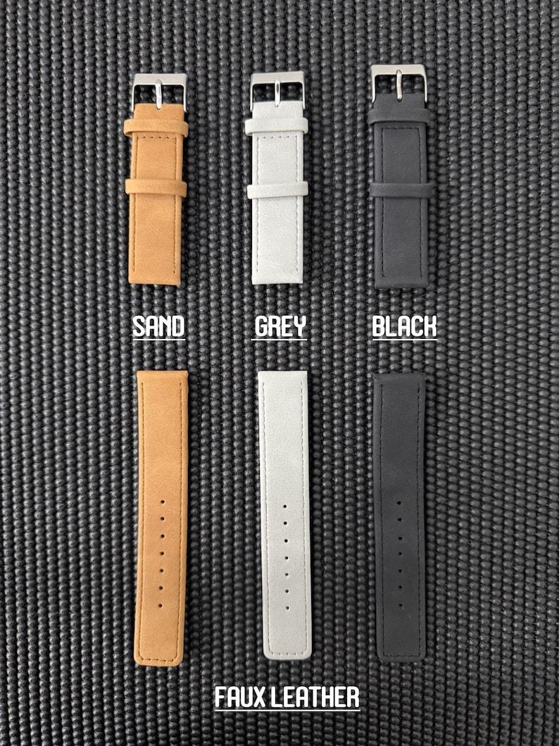 May include: Six faux leather watch straps in sand, grey, and black. Each strap has a silver buckle and is labeled with its color. The bottom row of straps is labeled "FAUX LEATHER".