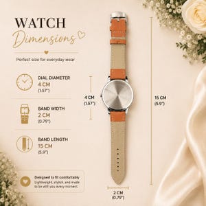 Puede incluir: Un reloj de pulsera con correa de cuero color canela y caja trasera plateada. El texto indica un di&aacute;metro de esfera de 4 cm, un ancho de correa de 2 cm y una longitud de correa de 15 cm. El reloj se muestra en posici&oacute;n vertical.