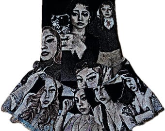 May include: Black and white tapestry featuring a collage of women's faces. The artwork has a unique, textured appearance, with a fringed edge at the bottom. The design incorporates various facial expressions and poses, creating a dynamic and artistic composition.