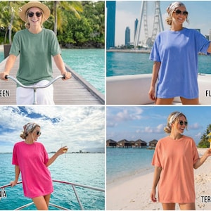 May include: Four images showcasing short-sleeved t-shirts in various colors: light green, flo blue, heliconia, and terracotta. Each image features a person wearing the shirt in a scenic outdoor setting. The text "LIGHT GREEN", "FLO BLUE", "HELICONIA", and "TERRACOTTA" are displayed.