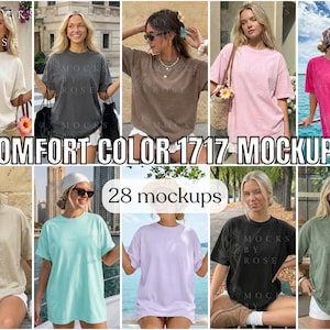 May include: A collection of women's t-shirt mockups in various colors, including cream, gray, brown, pink, and green. The text "COMFORT COLOR 1717 MOCKUPS" and "28 mockups" are displayed. The shirts are worn by models in outdoor settings.