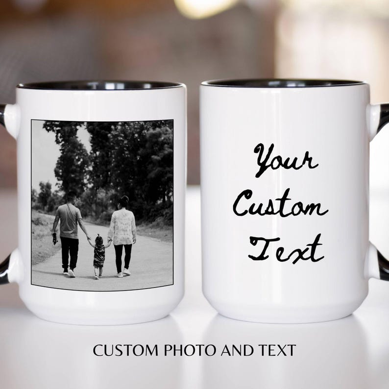 May include: White ceramic mug with a black interior and handle. One side features a black and white photo of a family walking. The other side has the text "Your Custom Text". The bottom of the mug reads "CUSTOM PHOTO AND TEXT".