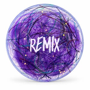 May include: A round, clear object with a swirling mix of purple, teal, and black fibers. The word "REMIX" is written in white across the center. Gold flecks are scattered throughout the design, creating a dynamic and textured appearance.