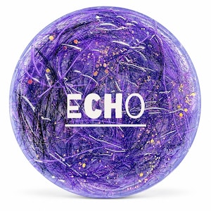 May include: A round, purple object with the word "ECHO" in white text. The object has a textured, glittery appearance with strands of purple and black, and flecks of gold.