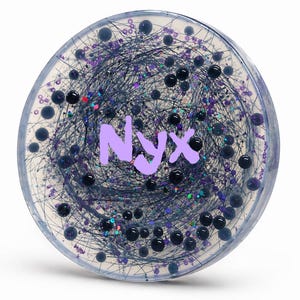 May include: A round, clear resin coaster with a swirling design of dark blue and purple threads, glitter, and black beads. The word "Nyx" is in light purple letters across the center.