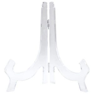 May include: A clear acrylic display stand with a curved design. The stand is made of two pieces that fit together to create a stable base for displaying items.