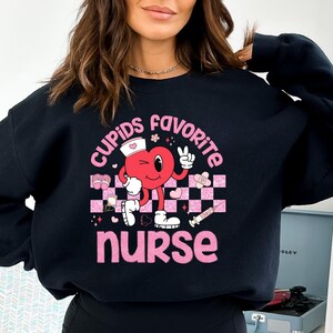 Cupid&#39;s Favorite Nurse Shirt, Nurse Squad Tee, Nurse Student Sweatshirt, Nurse Valentine Gift, Valentine Nurse Sweater, Nurse Valentine