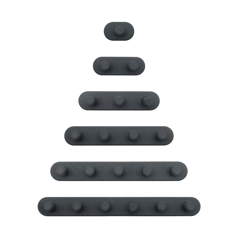May include: An assortment of dark grey cabinet pulls and knobs in an oval shape, displayed in a descending pyramid formation against a white backdrop. Each pull features a rounded knob.