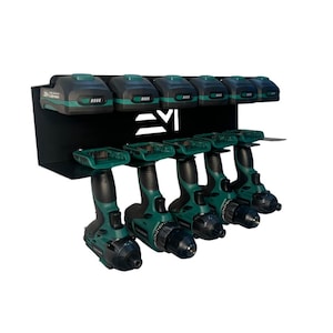 May include: A black metal drill and battery organizer with five green and black drills and five matching batteries. The organizer has a shelf for the batteries and a lower shelf for the drills.