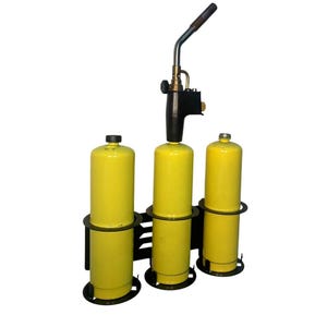 May include: A propane torch with three yellow propane tanks in a black metal holder. The torch has a black handle and a silver nozzle. The tanks are cylindrical and have black caps.