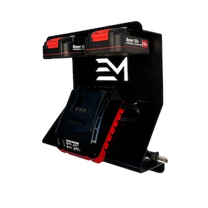 May include: Black metal power tool battery organizer and charger station. The station holds two Bauer 20V Hypermax Lithium batteries and a rapid charger. The batteries have red accents. The station has the letters "EM" in white.