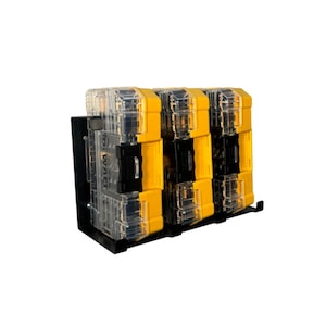 May include: A set of yellow, black, and clear plastic tool organizers mounted on a black metal bracket. The organizers are stacked and feature the "DEWALT" brand name.