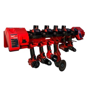 May include: A red power tool organizer with multiple power tools, including drills and a grinder. The organizer has a charger on the left side and is designed to hold several tools and batteries. The tools are red and black.