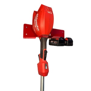 May include: A red and black Milwaukee FUEL cordless string trimmer with two black battery packs. The trimmer is mounted on a red bracket. The Milwaukee logo is visible on the trimmer.