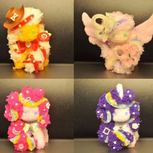 May include: A collection of six whimsical, plush animal figures. Each figure is adorned with colorful details, including hats, bows, wings, and decorative accents. The figures are in various colors, including yellow, pink, purple, and blue.