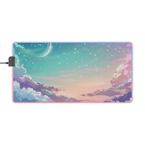 May include: A pastel-colored mouse pad with a starry night sky and a crescent moon design. The mouse pad has a soft, smooth surface and is perfect for gaming or everyday use.