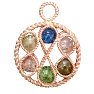 May include: A copper wire pendant with a circular design featuring seven colorful glass beads. The beads are arranged in a pattern and are held in place by the wire. The pendant has a loop at the top for attaching to a chain.