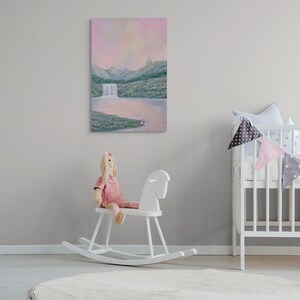 May include: A vertical landscape painting depicts a waterfall cascading into a lake, with mountains in the background. The artwork features soft pastel colors, including pink, green, and blue. A white rocking horse and a doll are in the foreground.