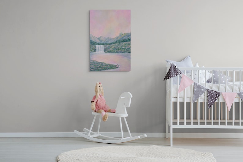May include: A vertical landscape painting depicts a waterfall cascading into a lake, with mountains in the background. The artwork features soft pastel colors, including pink, green, and blue. A white rocking horse and a doll are in the foreground.