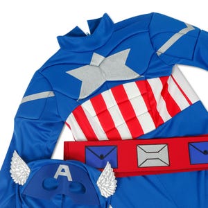 May include: A blue and red superhero costume with a silver star on the chest, a red belt with silver mailboxes, and a matching blue mask with silver wings.