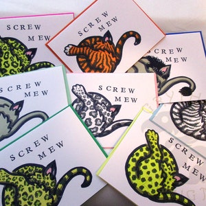 May include: Set of seven greeting cards with a humorous message, "Screw Mew." Each card features a different illustration of a cat in a variety of poses and colors.