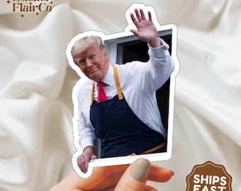 May include: A sticker featuring a photo of a man in a white shirt and a blue apron, waving from a doorway. The sticker has a white border and is held in a hand. The text "SHIPS FAST" is on a brown circle sticker in the lower right corner of the image.